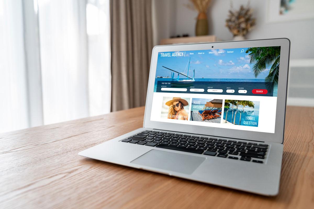 view of a laptop open to a page about booking a travel agent